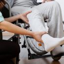 Person in a wheelchair getting orthopaedic assessment