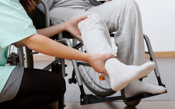 Person in a wheelchair getting orthopaedic assessment